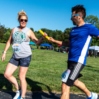 Summer Sunset Relay Handoff on course